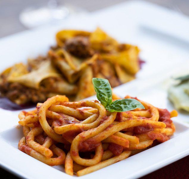 A plate of traditional pici pasta noodles in Florence