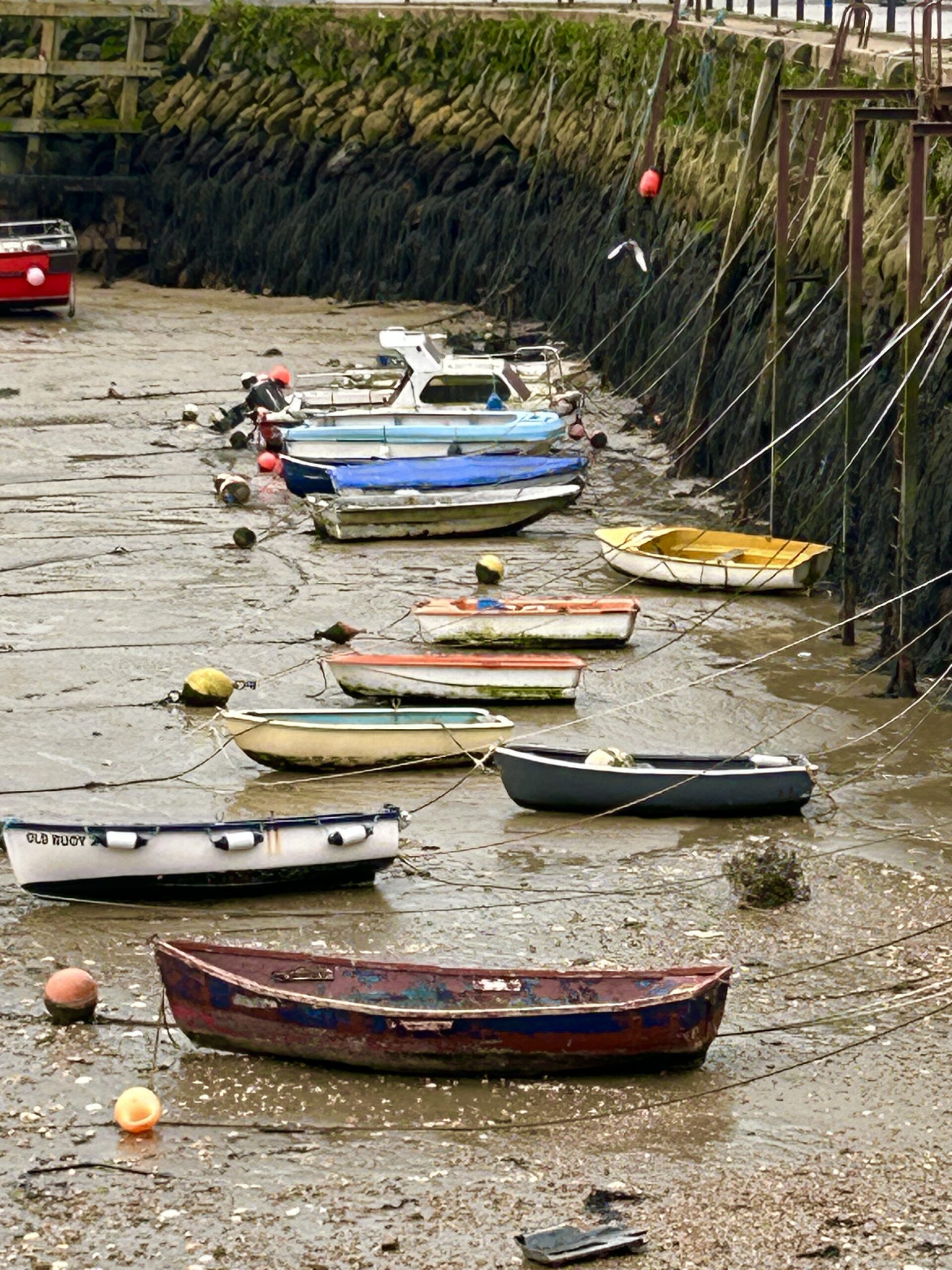 Boats on the ground in Folkstone Harbour near Canterbury, UK 