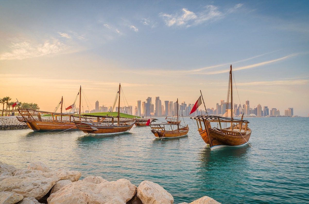 Doha, Qatar skyline with boats in the harbour.