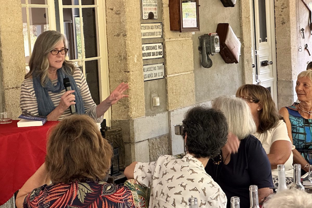 Author Jules Larimore speaking to a tour group during one of Absolutely Southern France's trips with best-selling authors