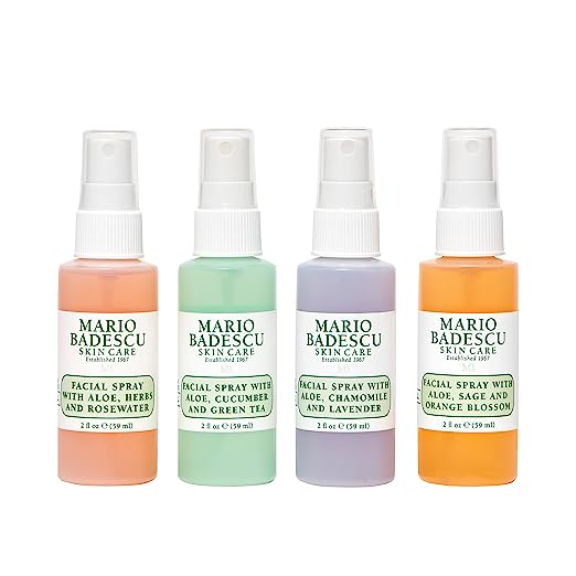 Four colourful mini spray bottles of facial hydrating spray
