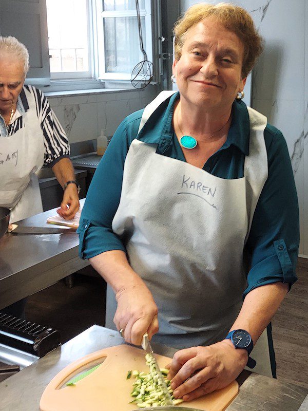Karen Gershowitz prepares a meal during a cooking class in Italy
