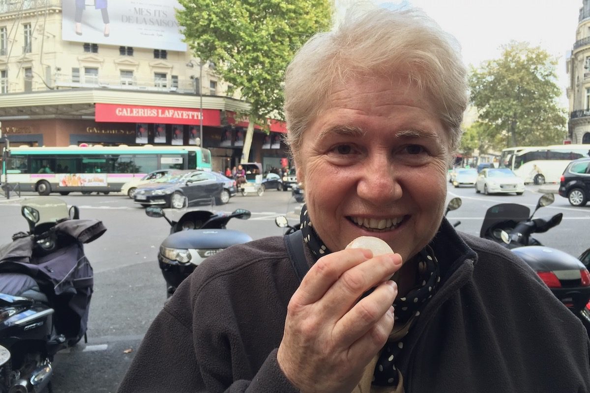 Leyla Alyanak enjoys a macaron in France