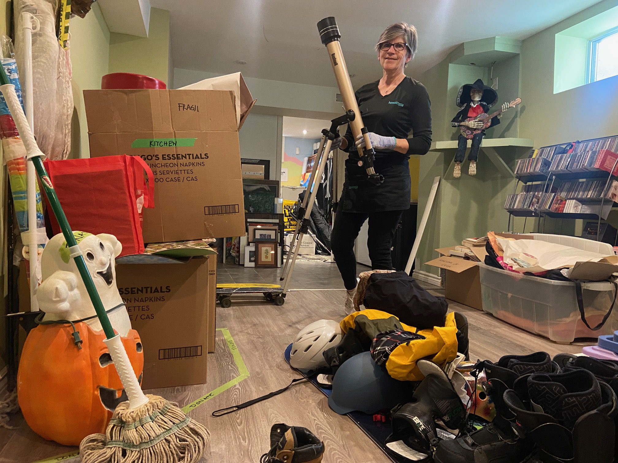 woman cleaning basement decluttering 
