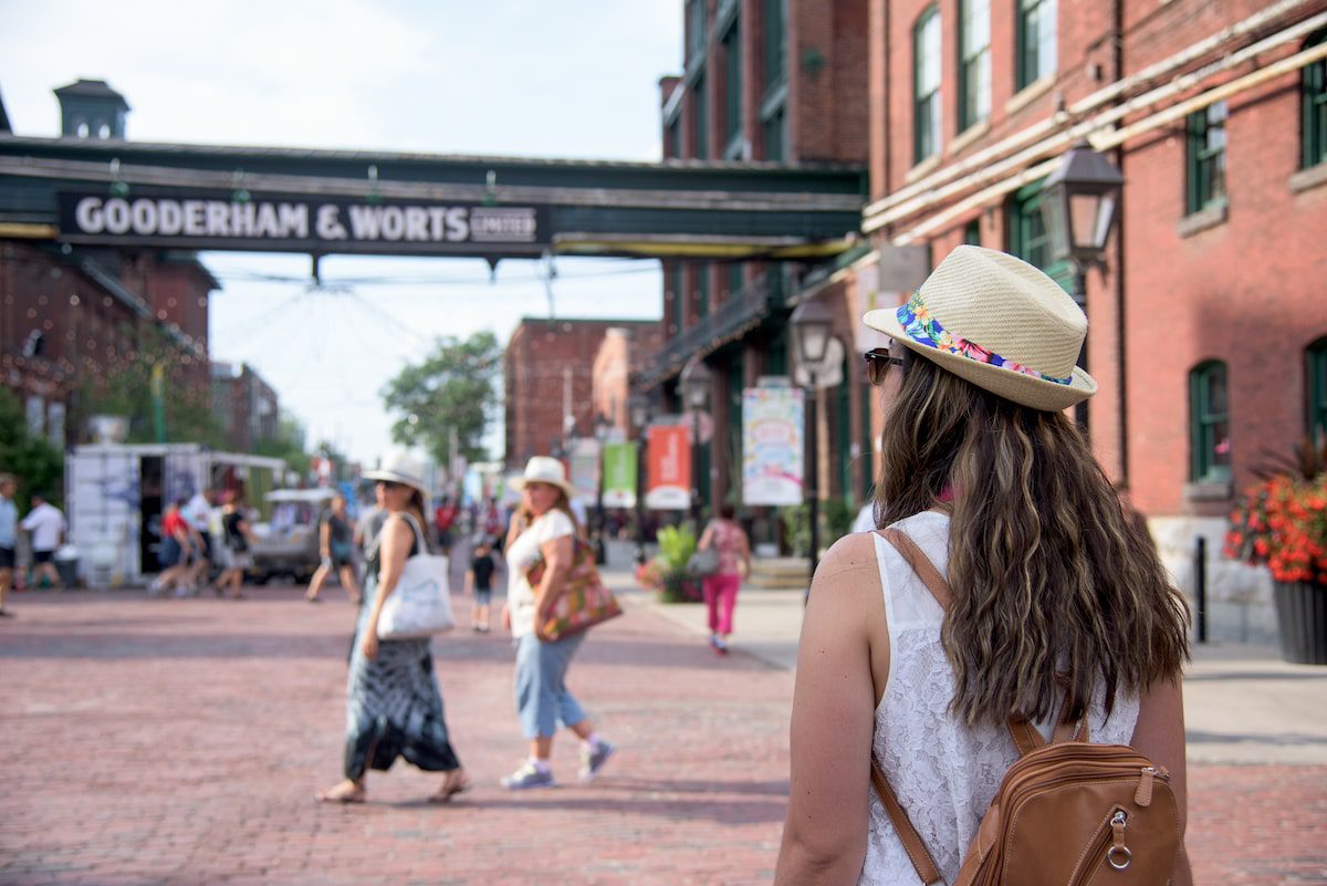 A woman exploring the Distillery District in Toronto