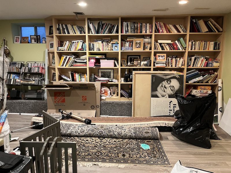 Erica Ehm's cluttered bookshelf before organizing