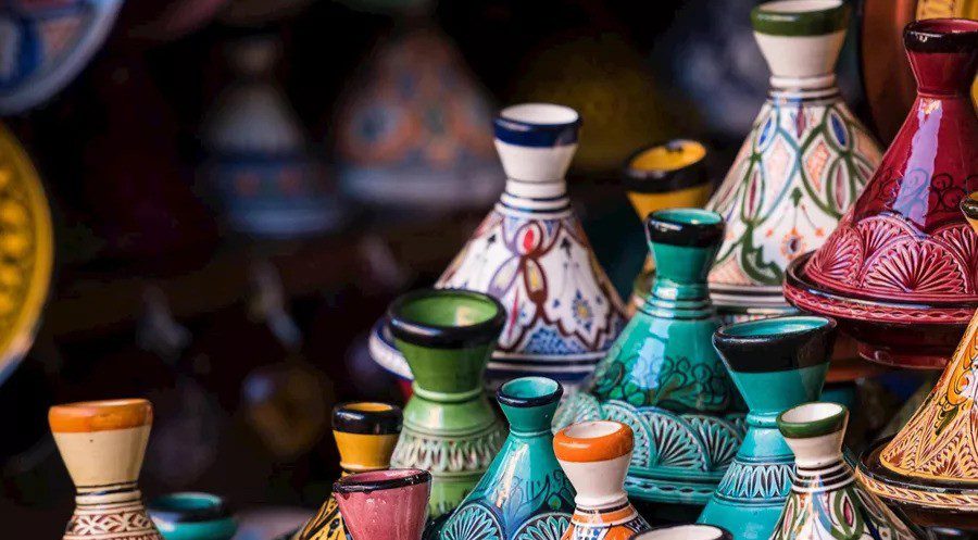 multiple small tagine pottery scattered in different colours