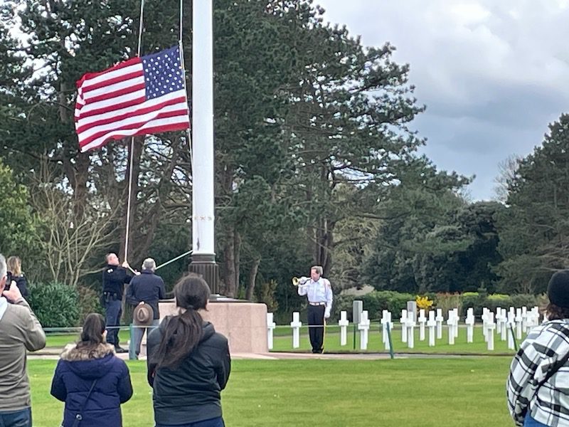 Lowering of the flag at the Normandy American Cemetery in Colleville-sur-Mer