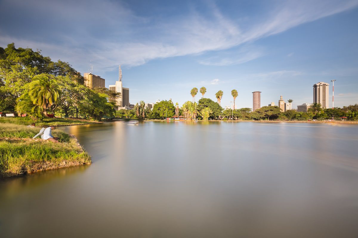 Long exposure of the skyline of Nairobi, Kenya with the beautiful lake in Uhuru Park in the foreground.