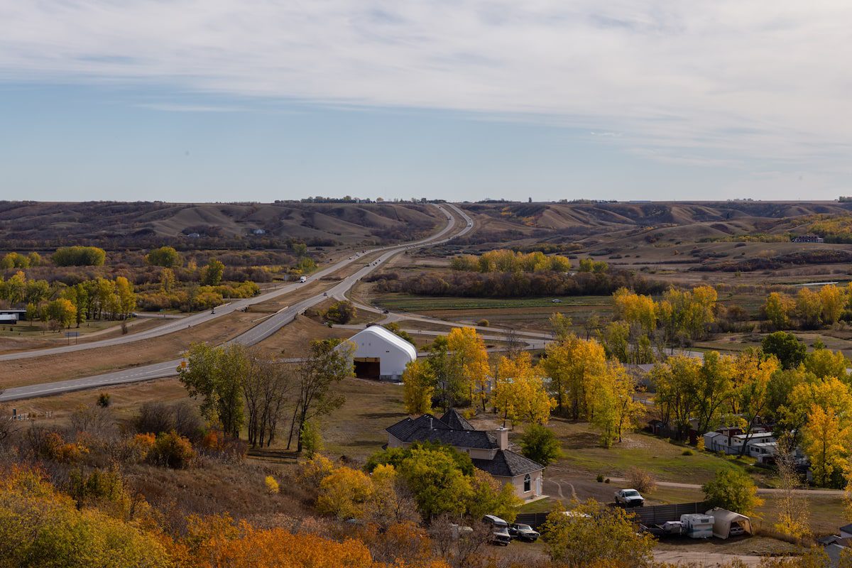 Panoramic view of a small Town in the Prairies during a vibrant sunny day in the Fall Season. Taken in Lumsden, Saskatchewan, Canada
