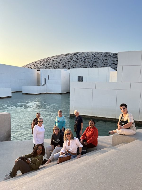 A group of women in front of the Abu Dhabi Louvre on a Women's Travel Group tour.