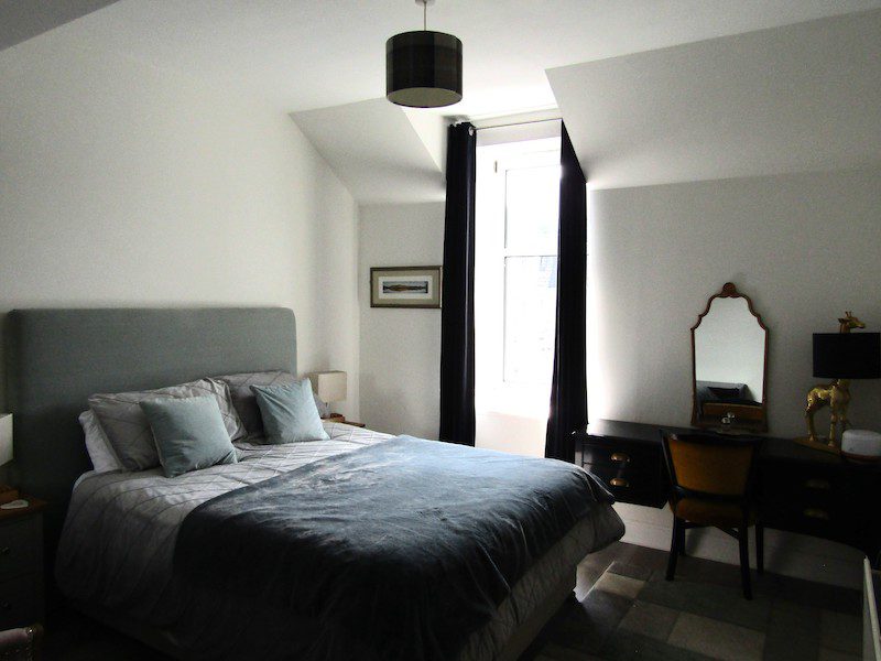 A cozy bedroom at the Alba Place Hotel in Pitlochry, Scotland