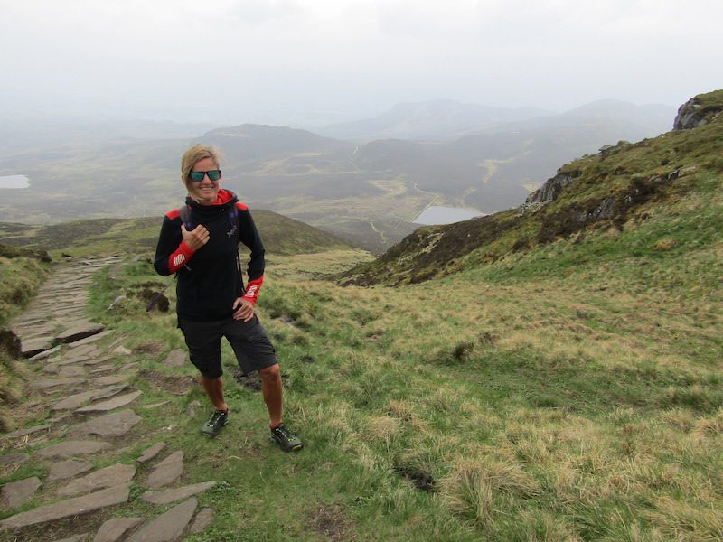 Jules Torti steps from the windswept summit of Ben Vrackie.