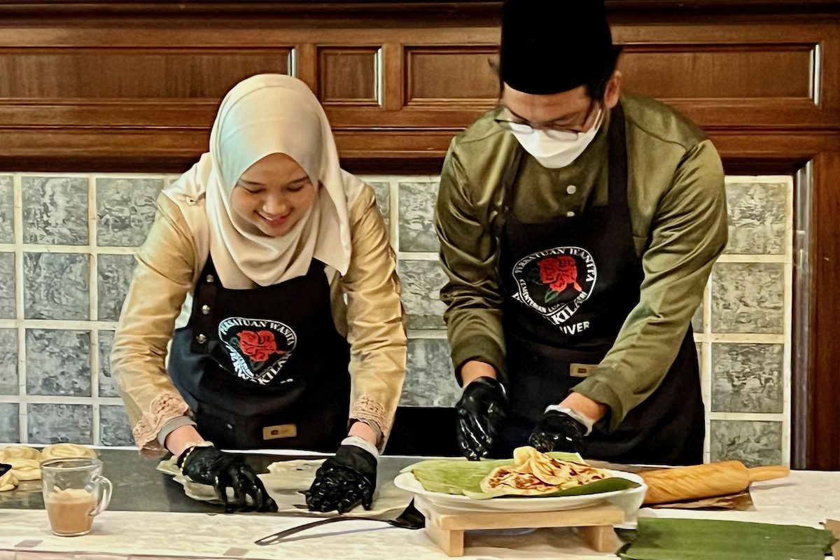 Student chefs at work preparing traditional Malaysian breakfast foods