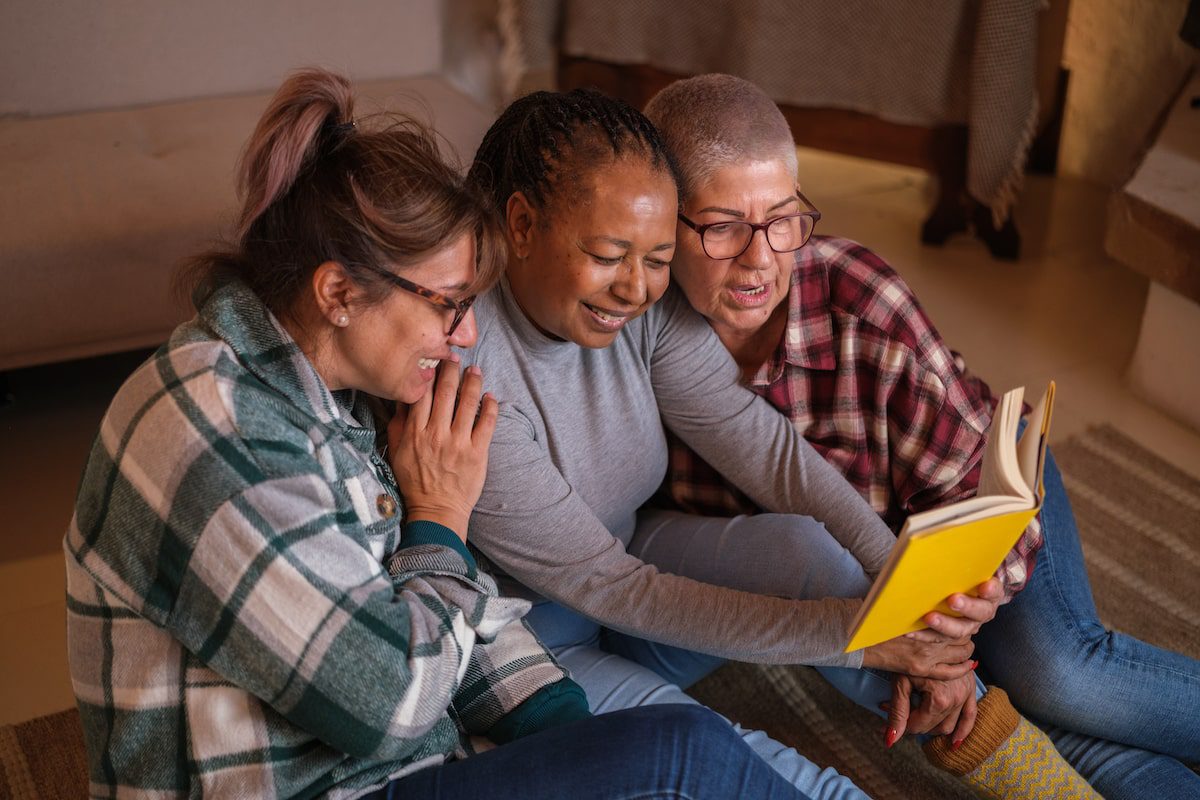 A group of women reading a book