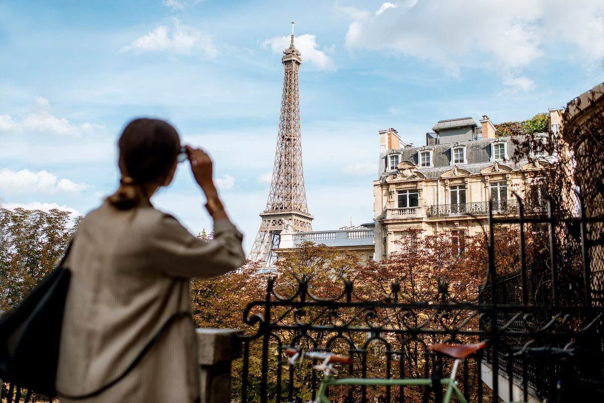 Woman enjoying view on the Eiffel tower in Paris