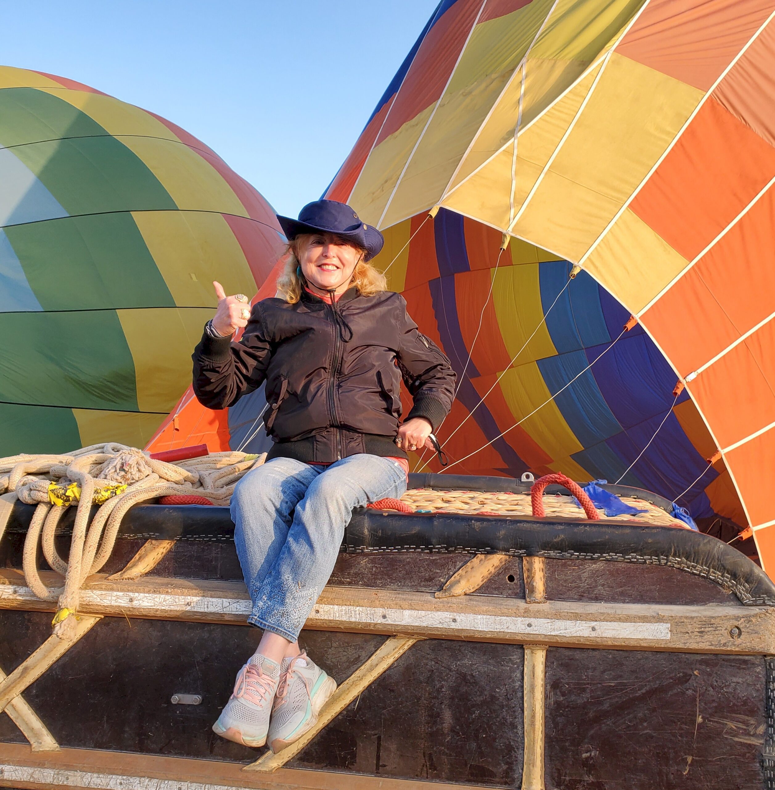 solo woman sitting on a hot air balloon