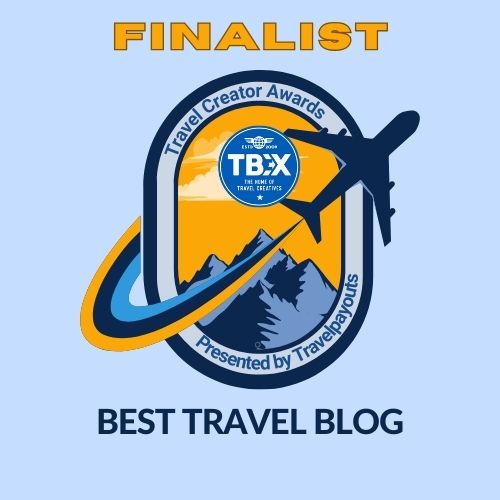 blue badge for finalist TBEX Travel Blog awards