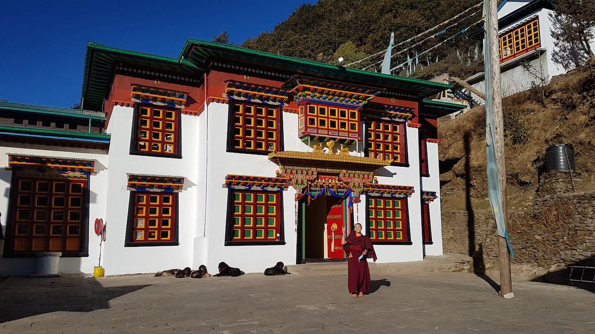 A young ani outside the puja hall at Thubten Chholing Monastery