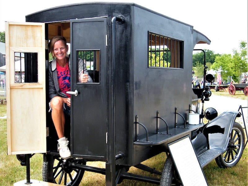  In the paddy wagon at the Saints & Sinners, a celebration of bootlegger history  in Owen Sound, Ontario.