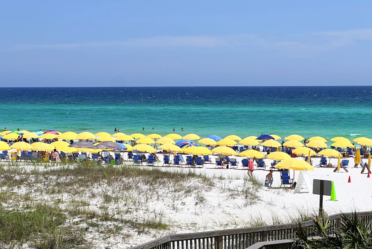 Yellow umbrellas line the Sandestin Beach in Destin