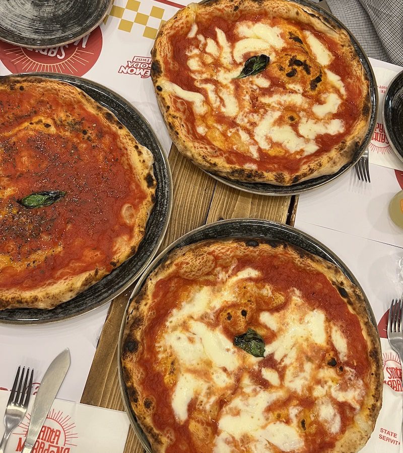 A traditional Margherita and Marinara pizza in Naples