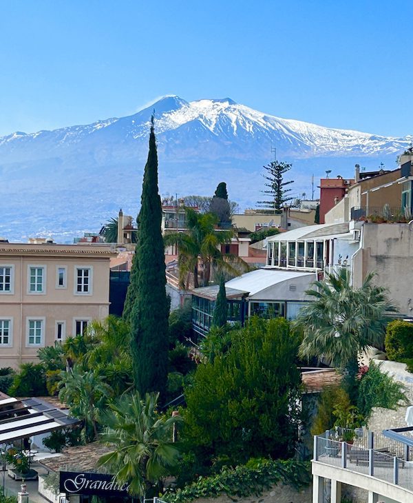 View of snow-covered Mt Etna from Taormina, Sicily