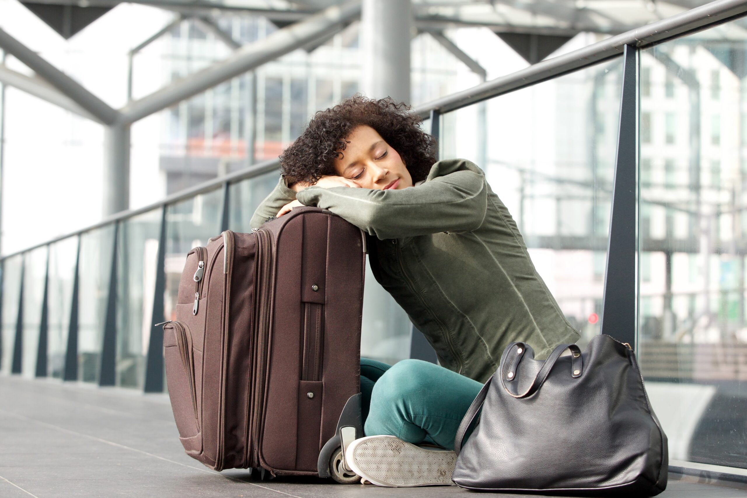 woman sleeping at airport