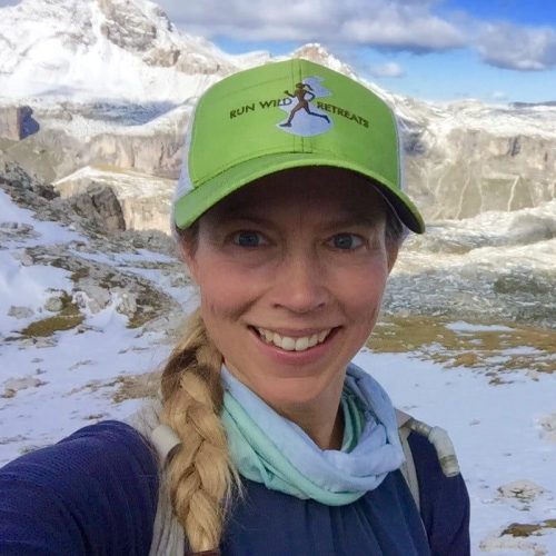 Smiling active woman running Elinor Fish Run Wild Retreats 