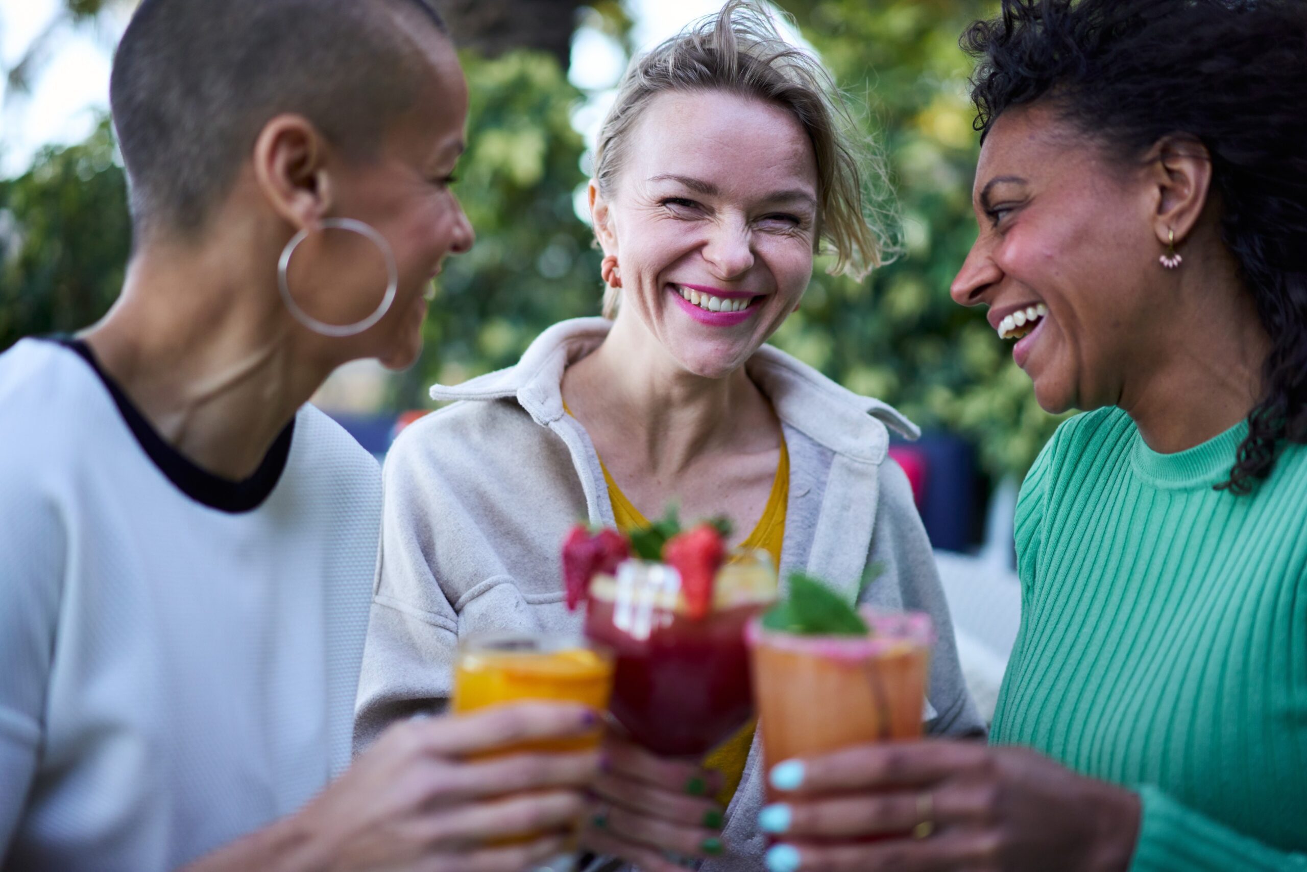 three women enjoying non-alcoholic drinks