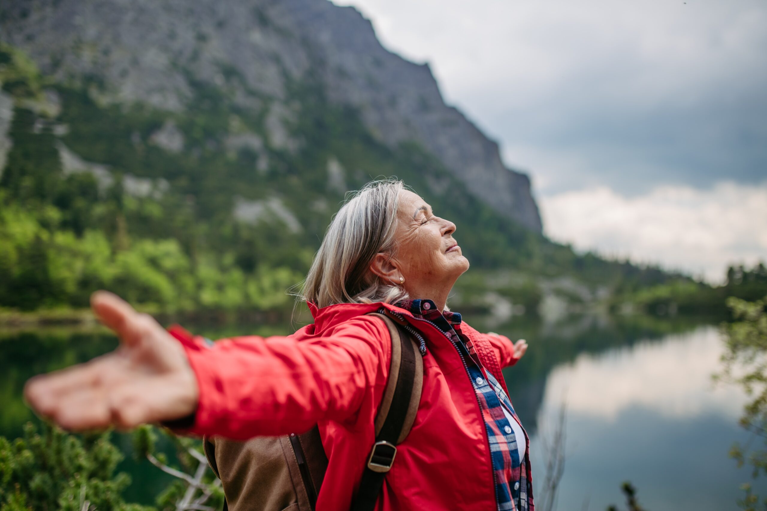 happy older woman over 50 in travel