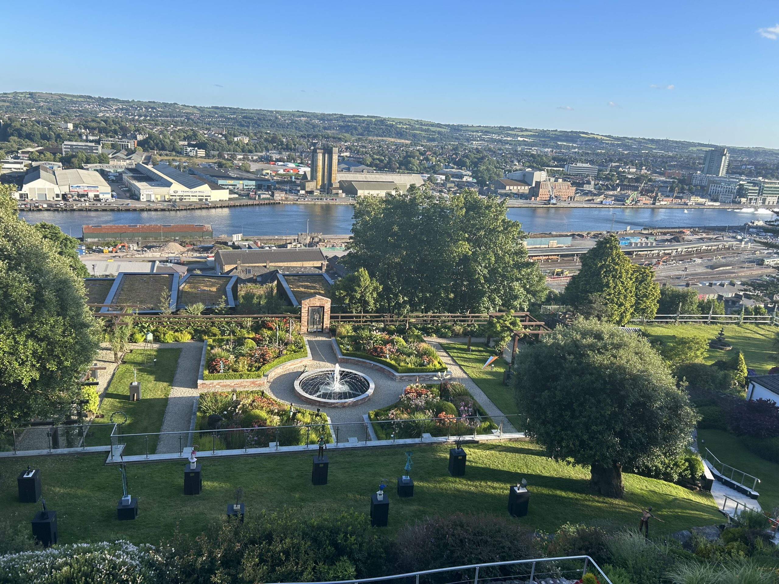 view from a hillside of a city below cork ireland