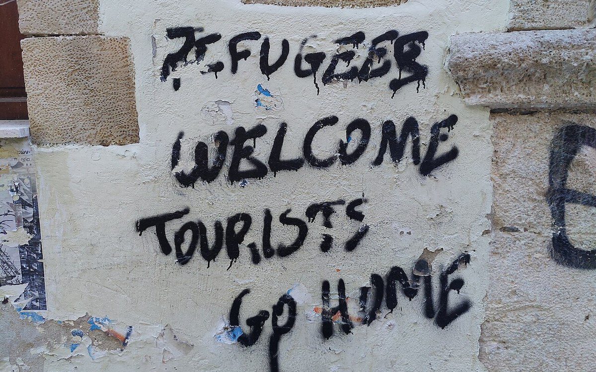 "Tourist Go Home" seen on a wall in Crete, Greece