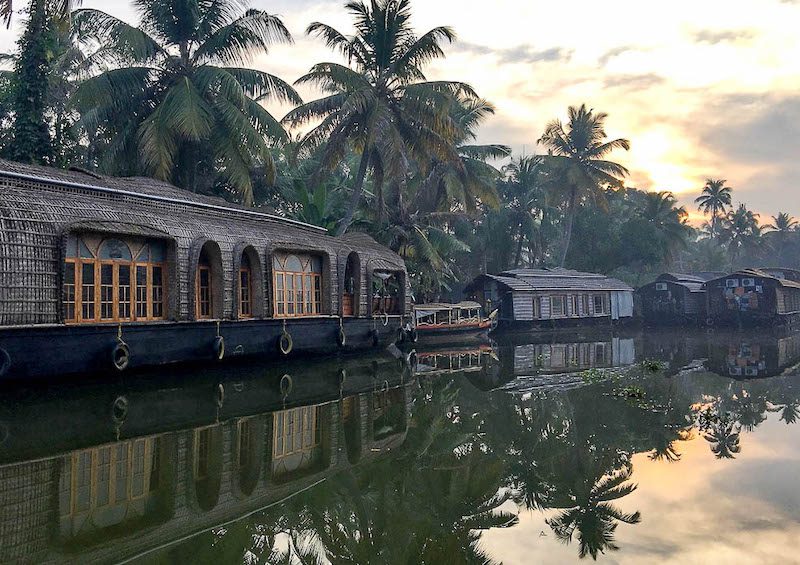 Houseboats on the backwaters at dawn in Kerala, India