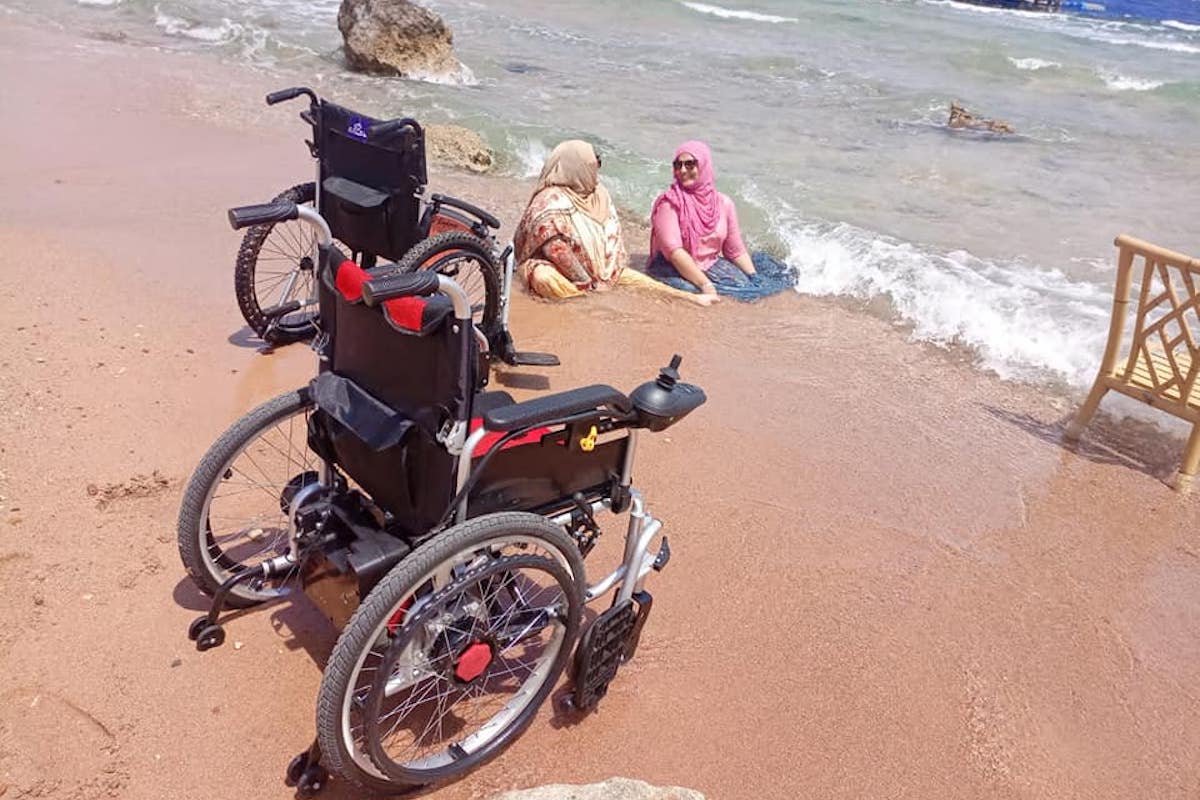 Two women travel Egypt in a wheelchair and enjoy the beach at Sharm el Sheikh Resort