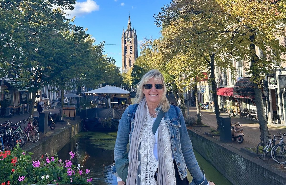 Carolyn Ray in front of a canal in Delft, Amsterdam.