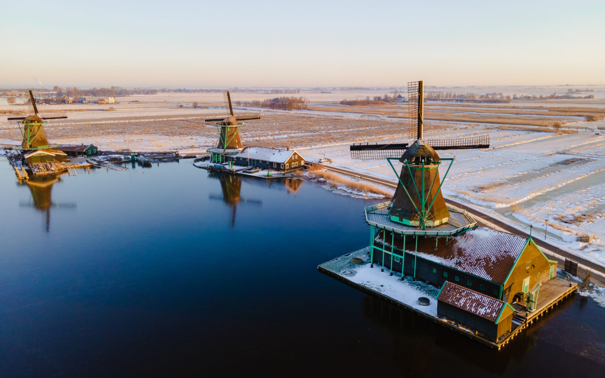 snow at the Zaanse Schans windmill village during winter with snow landscape in the Netherlands