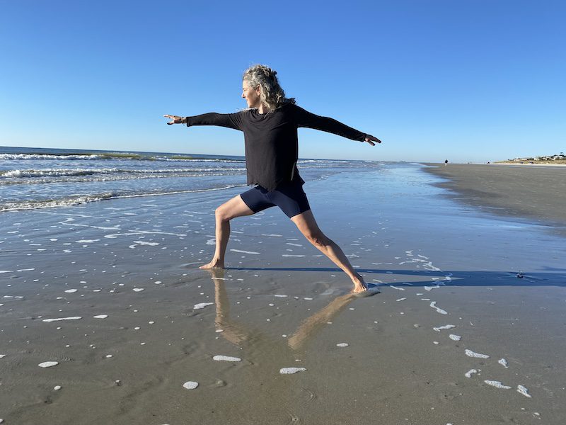 Diana Ballon doing beach yoga on wellness retreat