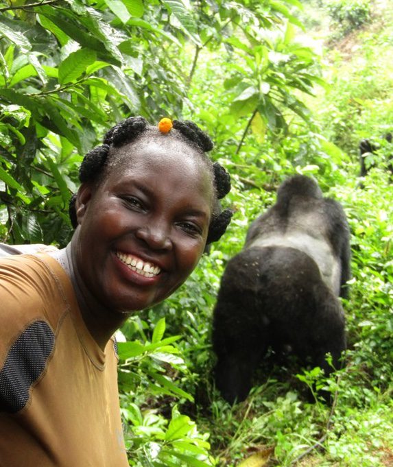 Irene Nalwoga with the gorilla during gorilla trek. Credit Women Tour Uganda