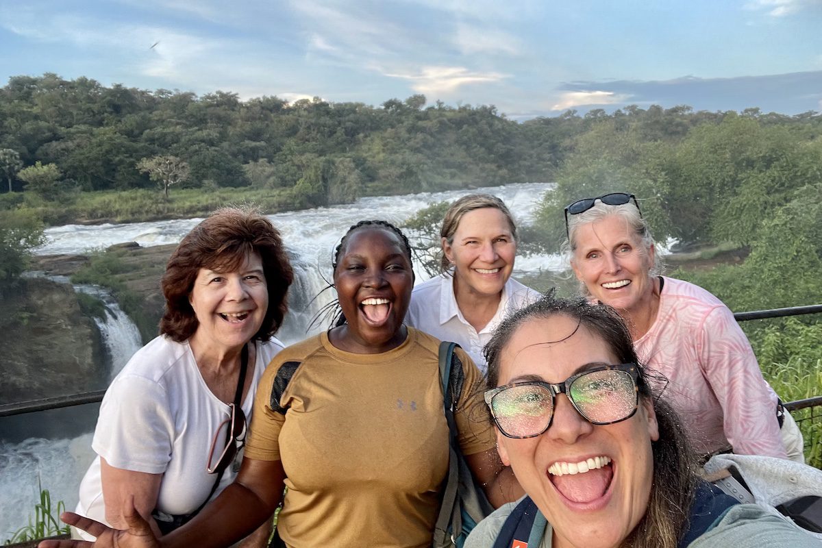 Irene Nalwoga with solo women at the top of Murchison falls. Photo by Tiffaney Kelman