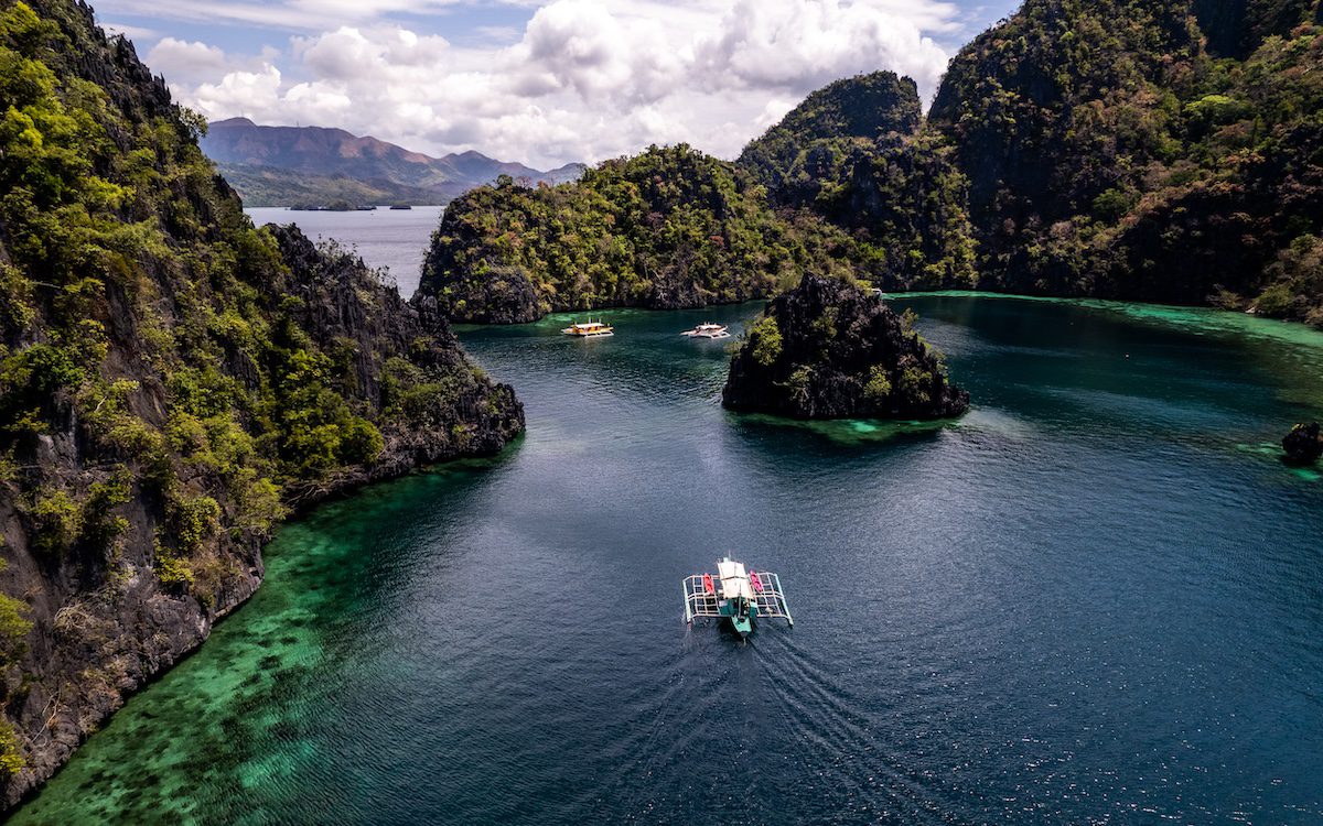 Aerial view of Twin Lagoon turquoise waters with a drone The Philippines.