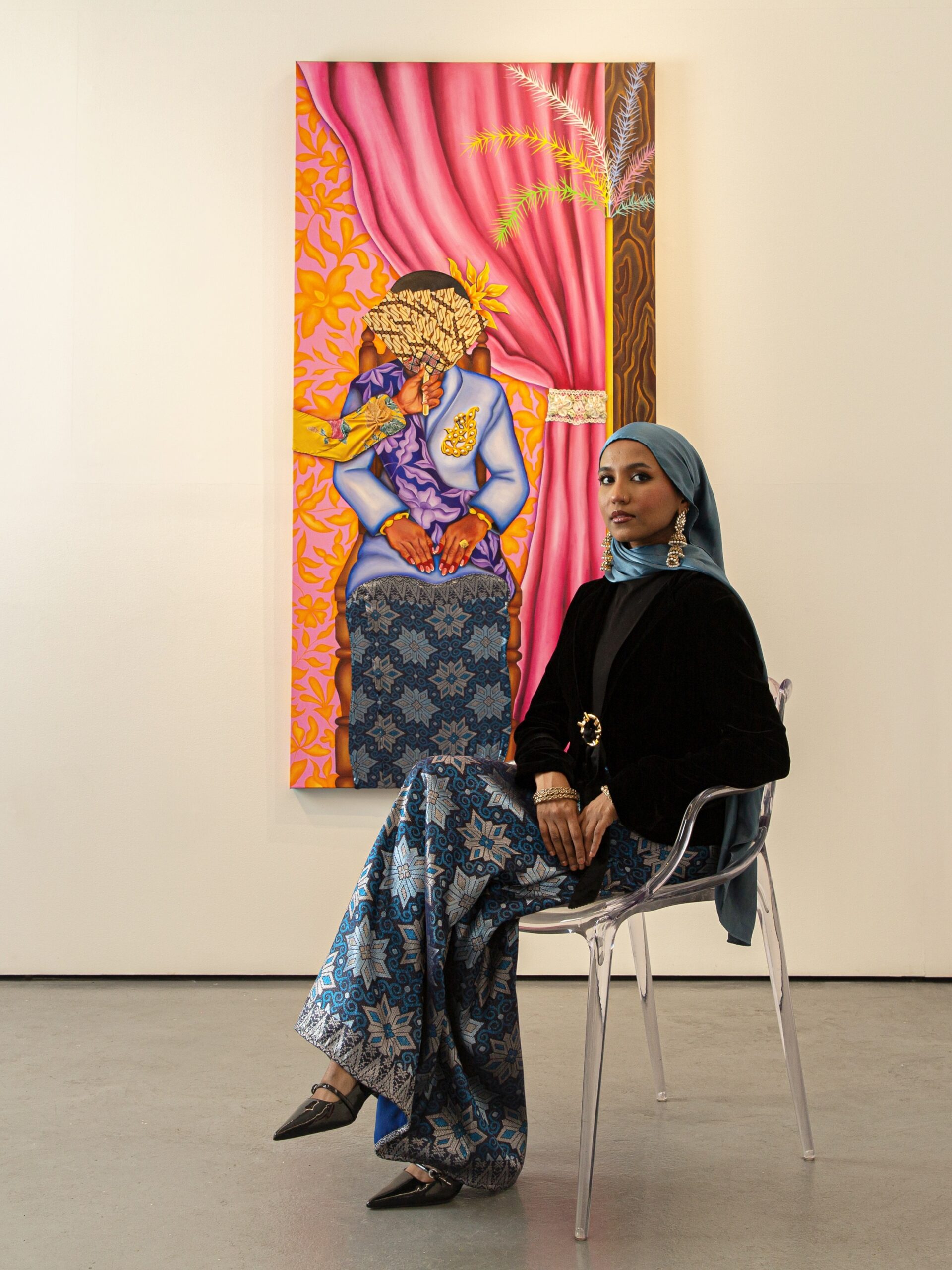 woman sitting in front of colourful art malaysia 