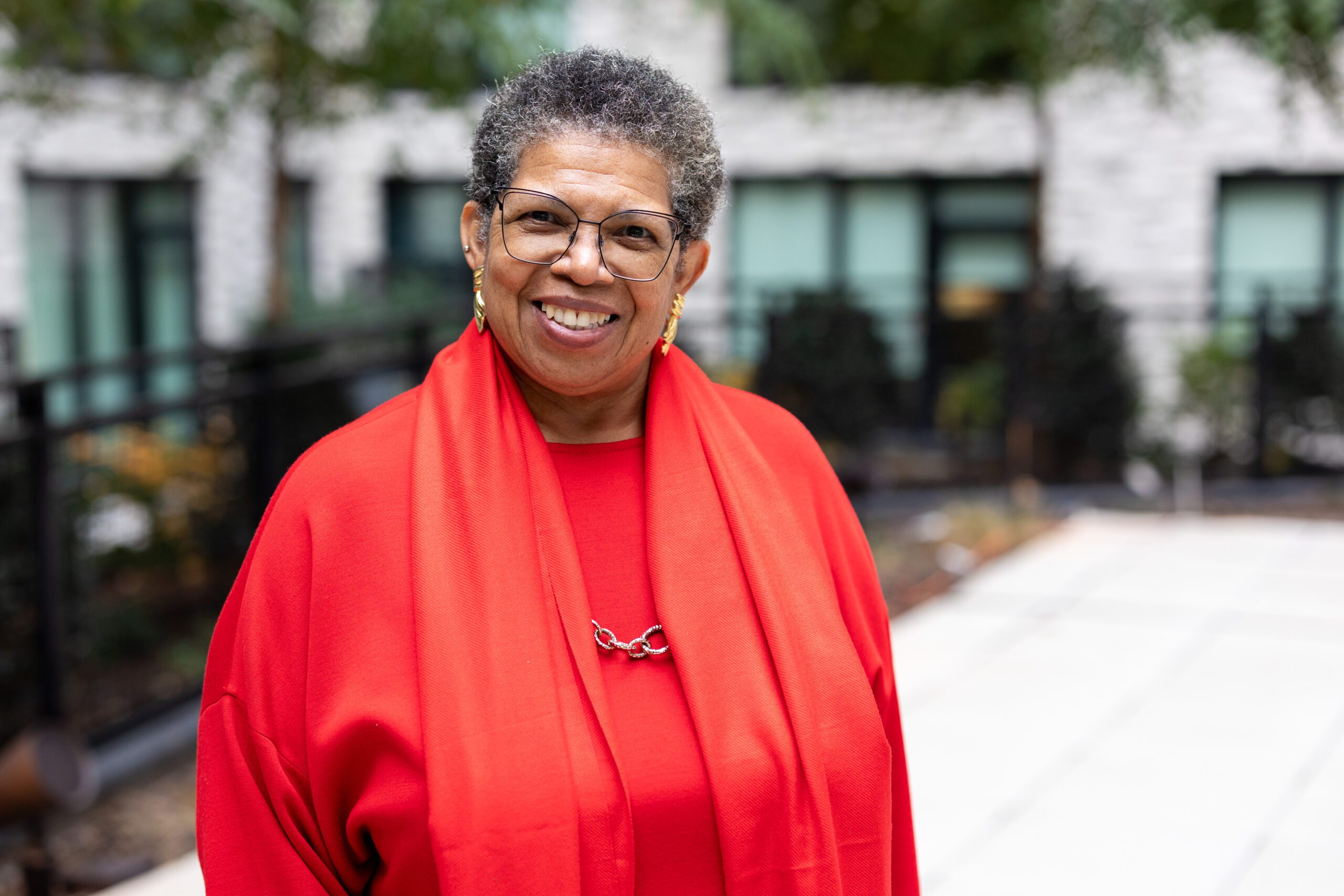 Mary K Clark red shirt smiling woman