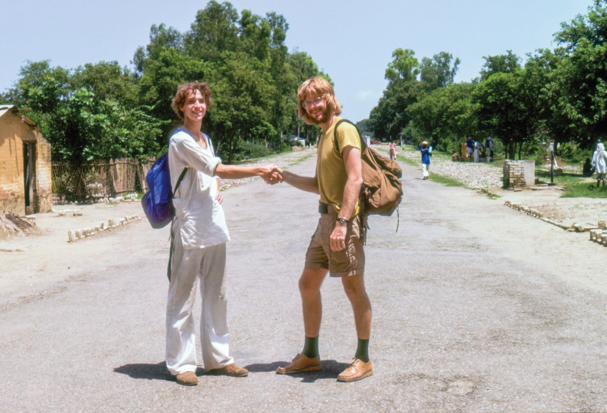 two men walking with backpacks rick steves