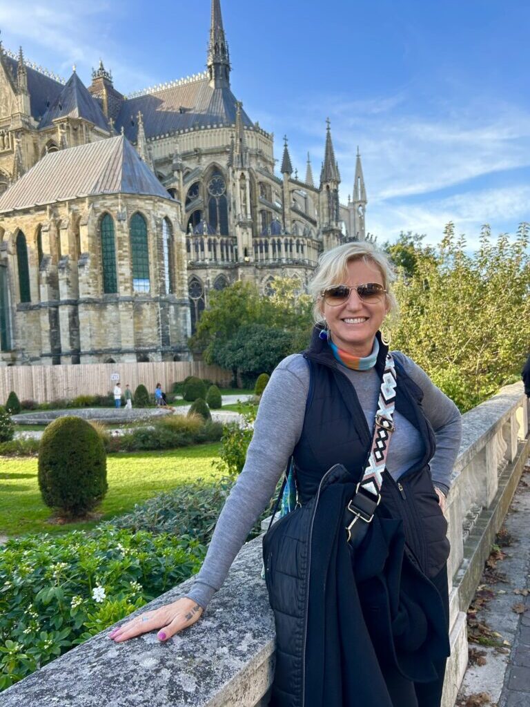 Reims France Cathedral Carolyn woman standing in front of cathedral reims france