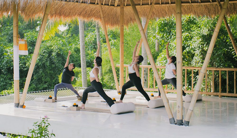 Wellness Goddess Retreat Women doing yoga on a Luxury and Transformation for Women with Goddess Retreats