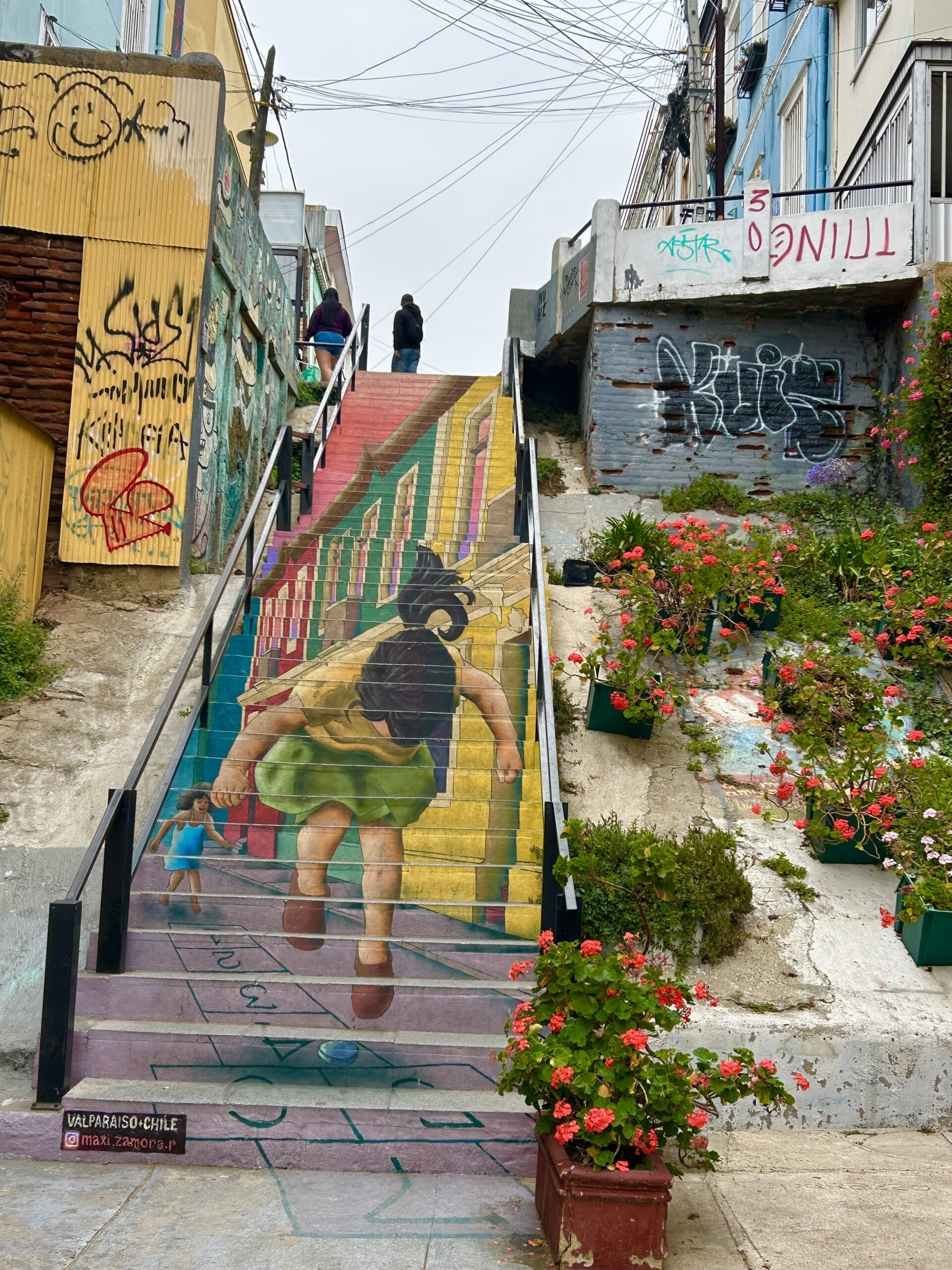 valparaiso street art stairs girl Carolyn woman standing in front of cathedral reims france