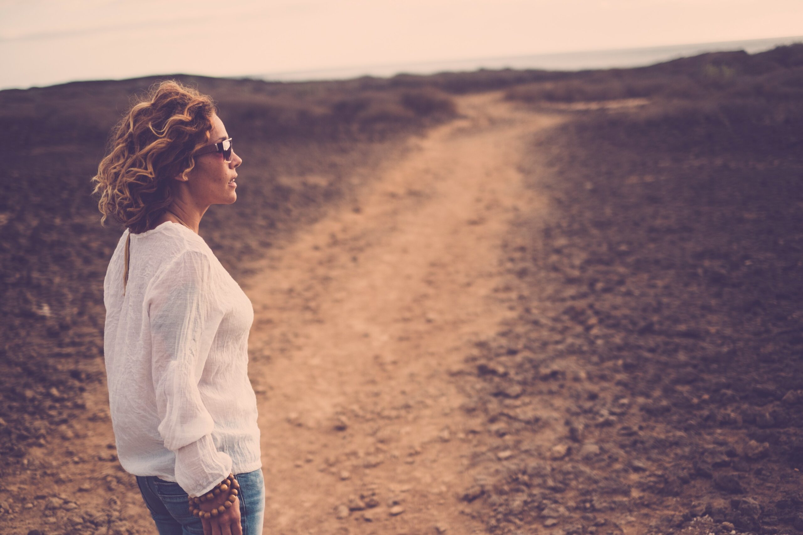 woman standing desert transformational travel