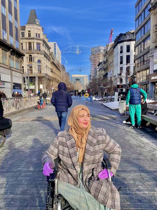 Tanzila Exploring a street in Brussels in a wheelchari, Belgium