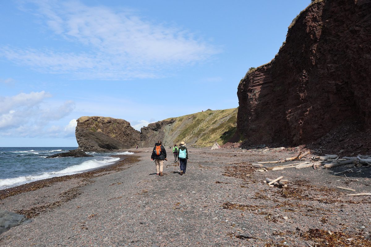 Walking beneath towering sea cliffs on Green Gardens’ shoreline section